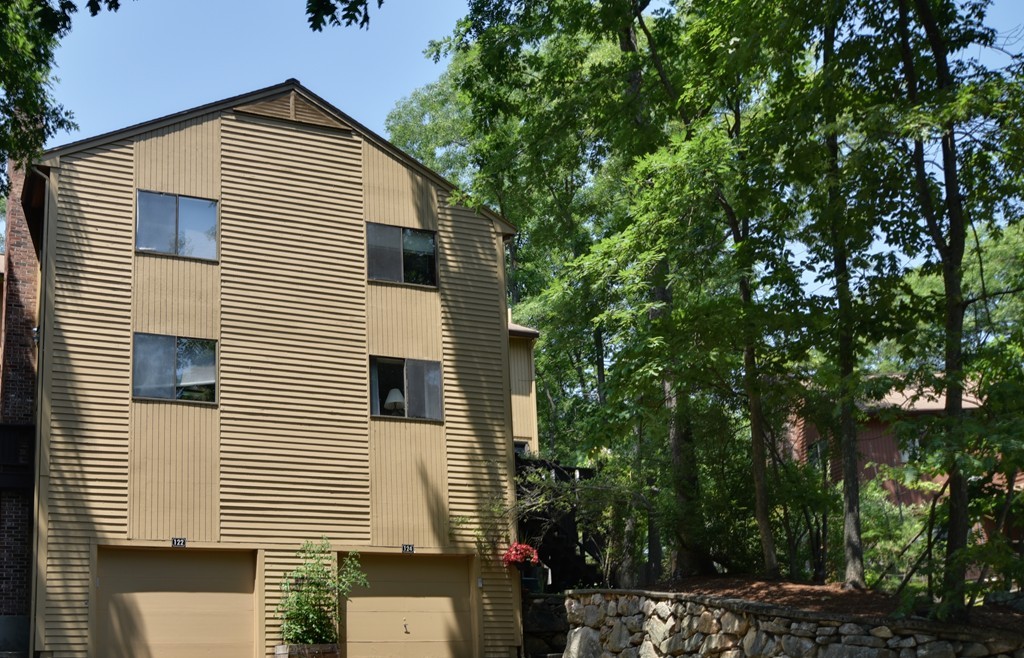124 Mountain Gate Road, Unit 124 Ashland, MA 01721 - Photo 1 of 19 a view of a house with a yard