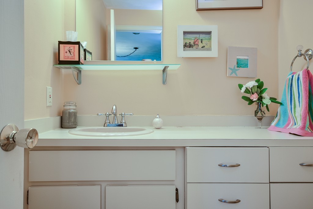 124 Mountain Gate Road, Unit 124 Ashland, MA 01721 - Photo 15 of 19 a bathroom with a sink and a mirror