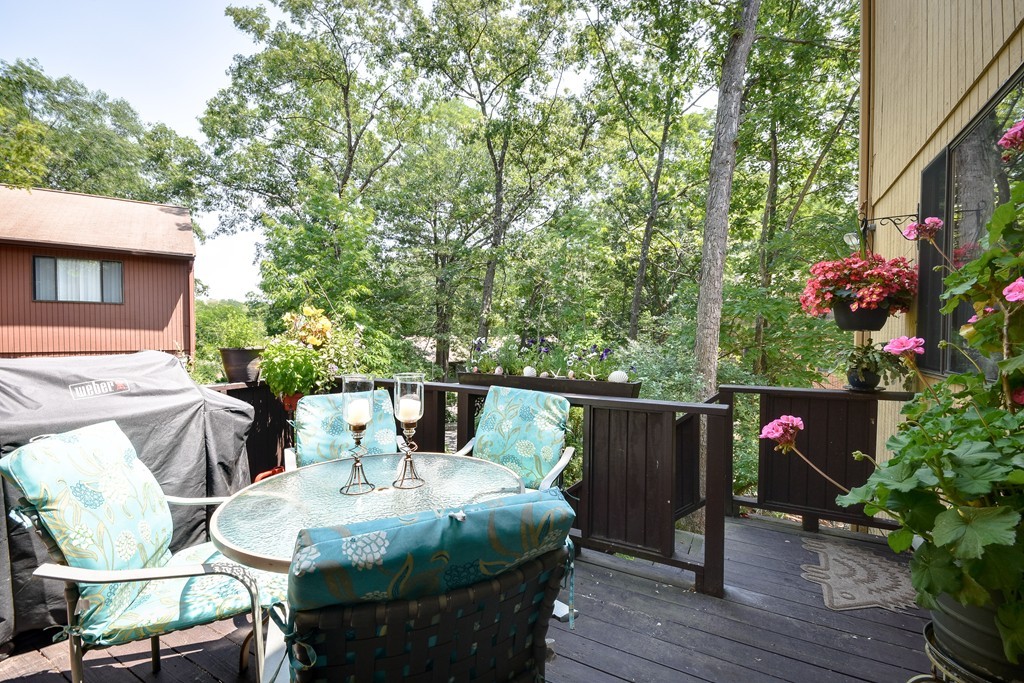 124 Mountain Gate Road, Unit 124 Ashland, MA 01721 - Photo 19 of 19 a terrace with outdoor seating and wooden floor