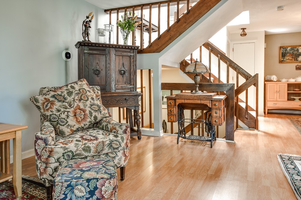 124 Mountain Gate Road, Unit 124 Ashland, MA 01721 - Photo 7 of 19 a view of entryway livingroom and hall with wooden floor