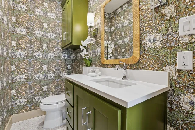 a bedroom with a large bed and a couch