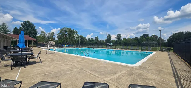 a view of swimming pool with a patio