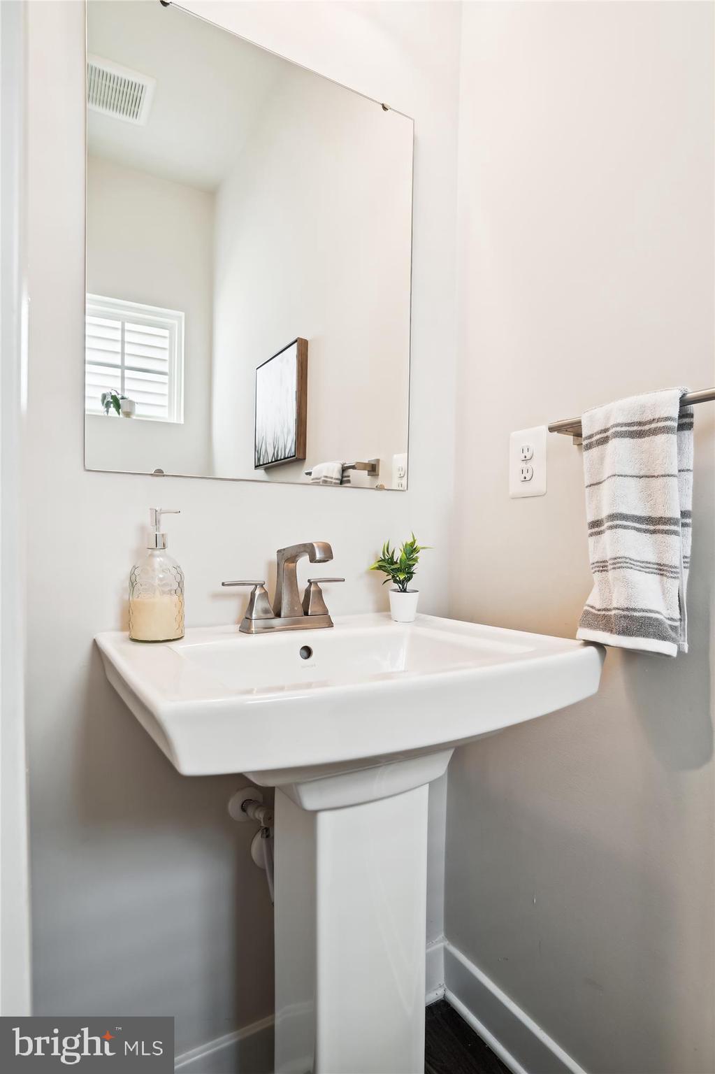 1279 Upper Patuxent Ridge Road Odenton, MD 21113 - Photo 35 of 107 POWDER ROOM W/ PEDESTAL SINK & LVP FLOORING