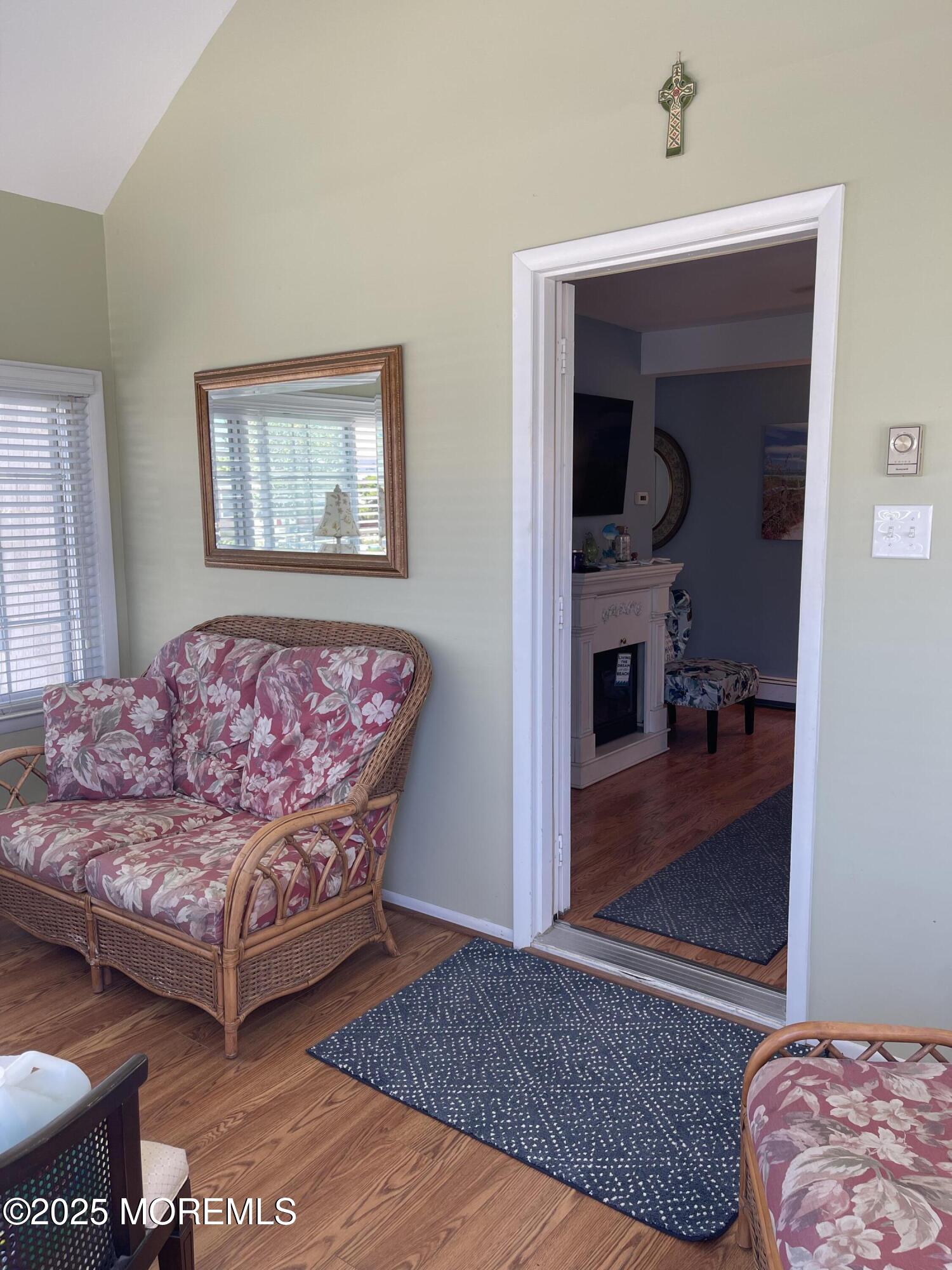 102 Brown Avenue Lavallette, NJ 08735 - Photo 12 of 22 a living room with a couch and a dresser with wooden floor