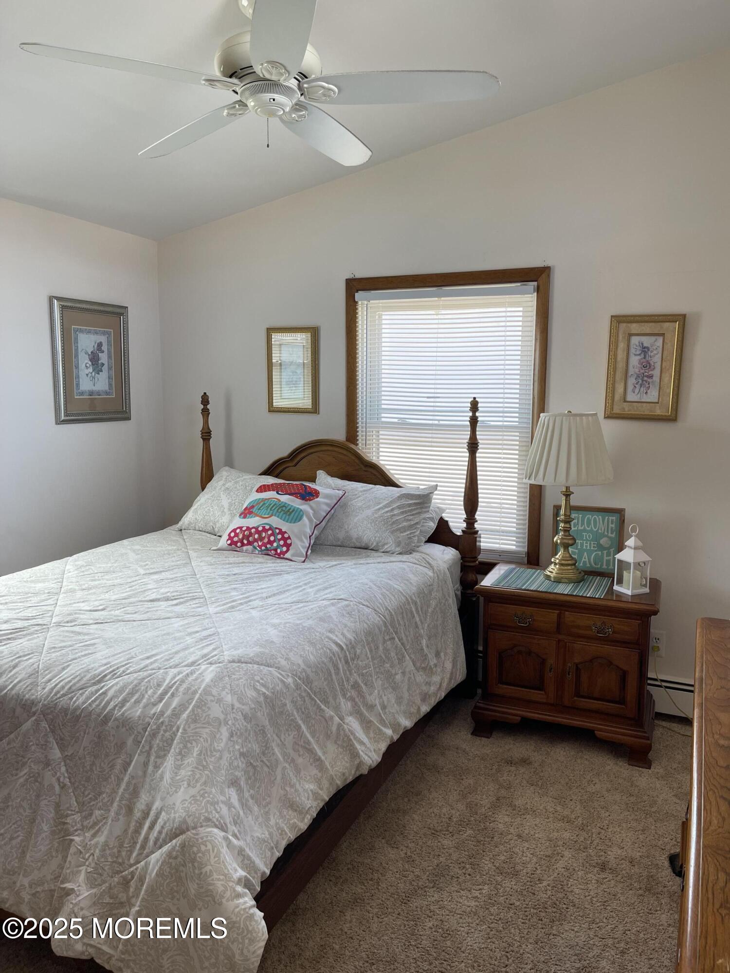 102 Brown Avenue Lavallette, NJ 08735 - Photo 5 of 22 a bedroom with a bed and a window