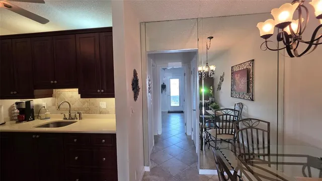 a kitchen with a sink cabinets and window