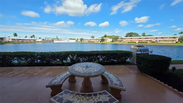 a view of a swimming pool and lounge chair