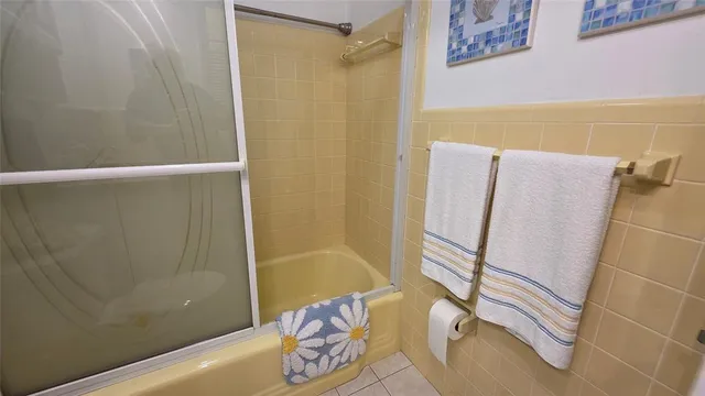 a bathroom with a bathtub and shower