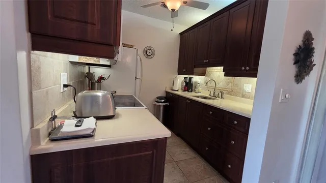a bathroom with a sink vanity and mirror