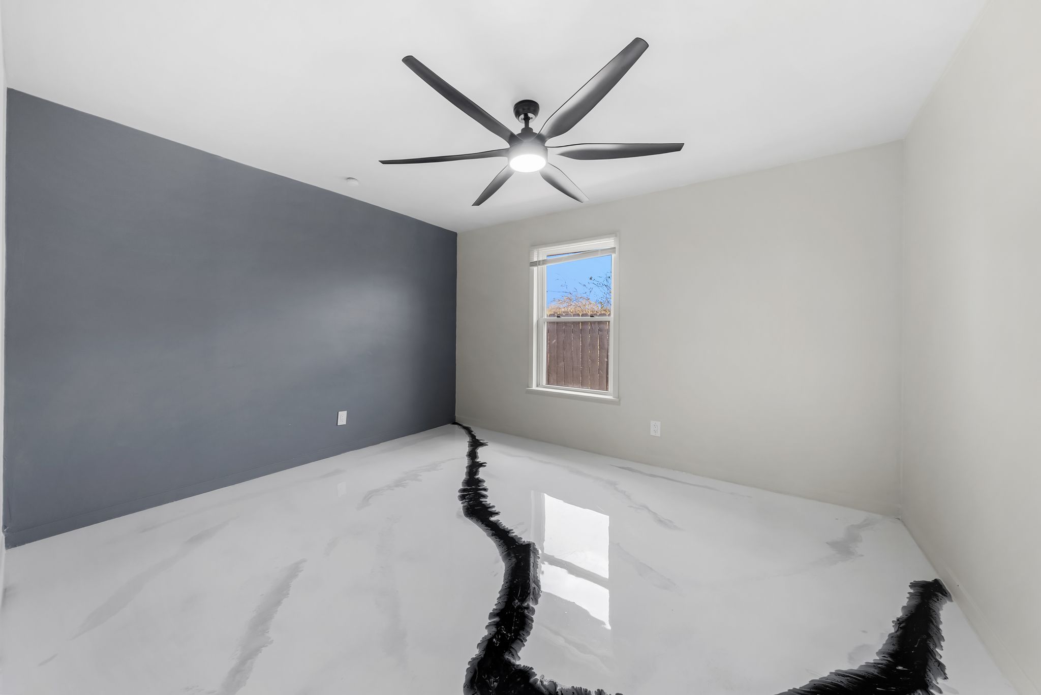 2201 Teri Road Austin, TX 78744 - Photo 11 of 37 a bedroom with a bed and a ceiling fan