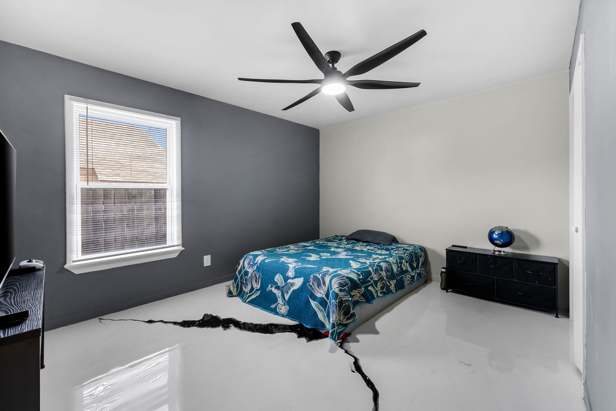 2201 Teri Road Austin, TX 78744 - Photo 12 of 37 a bedroom with a bed and a window