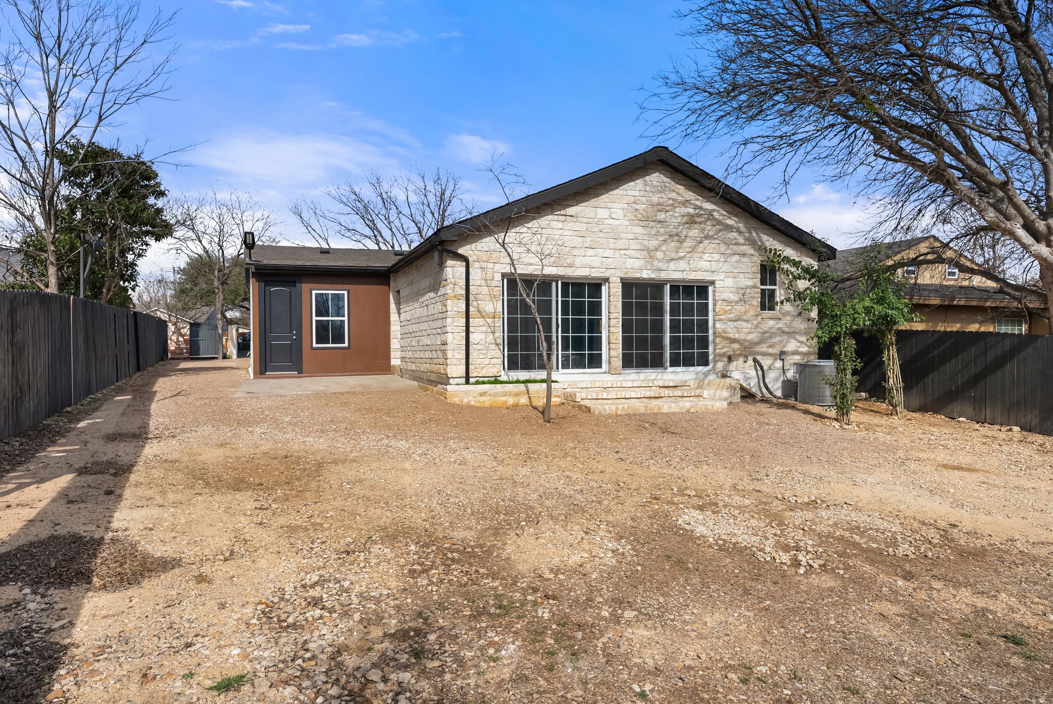 2201 Teri Road Austin, TX 78744 - Photo 23 of 37 a house with trees in the background