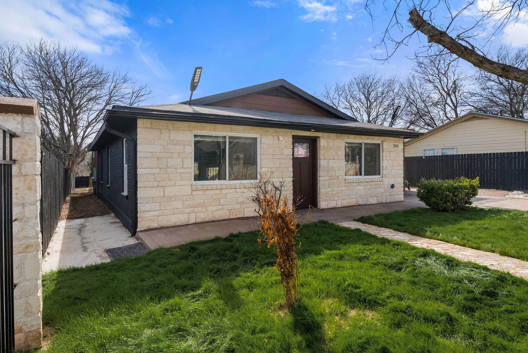 2201 Teri Road Austin, TX 78744 - Photo 29 of 37 a view of a house with a yard