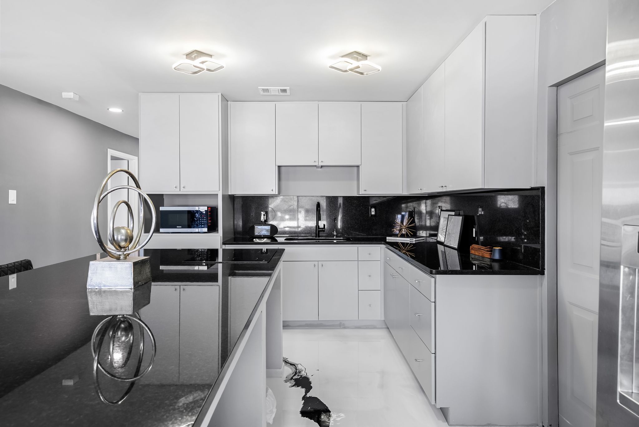 2201 Teri Road Austin, TX 78744 - Photo 8 of 37 a kitchen with granite countertop a sink a stove and cabinets