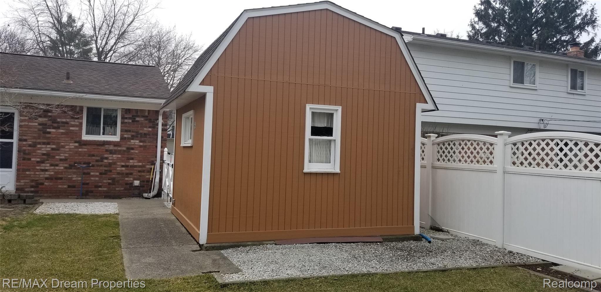 6533 Flintlock Ridge Utica, MI 48317 - Photo 37 of 53 HUGE 2 STORY SHED FOR STORAGE WITH UPPER ATTIC, AND ELECTRICITY