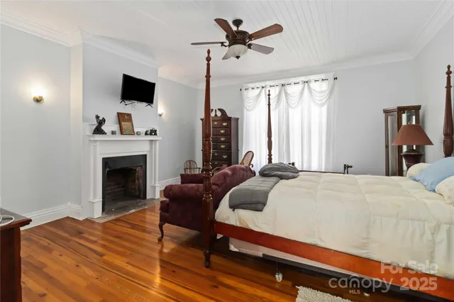 a bedroom with a bed and a fireplace