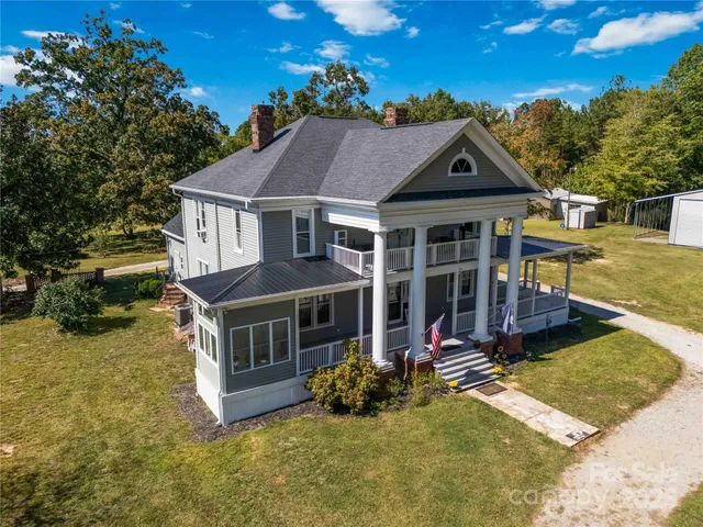 a front view of house with yard outdoor seating and barbeque oven