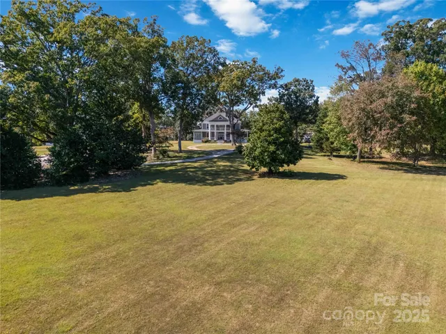 a view of swimming pool with an outdoor space and seating area