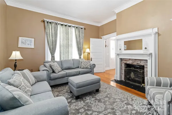 a living room with furniture and a fireplace