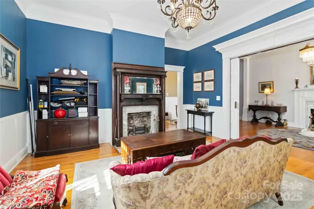 a living room with fireplace furniture and a flat screen tv