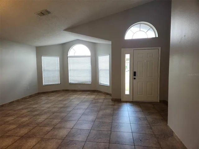 a view of a hallway with front door