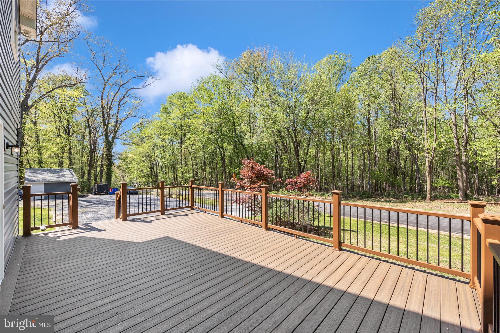 6518 Woodville Road Mount Airy, MD 21771 - Photo 50 of 53 a view of a deck with large trees