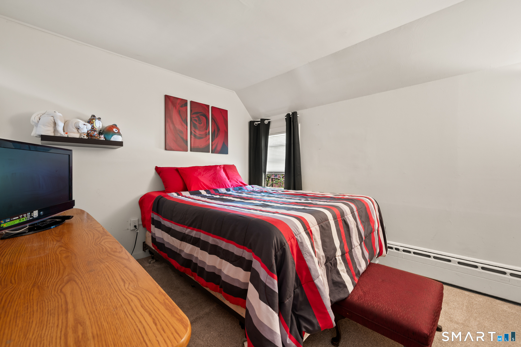 3 Flower Street Middletown, CT 06457 - Photo 11 of 17 a bedroom with a bed and a flat screen tv