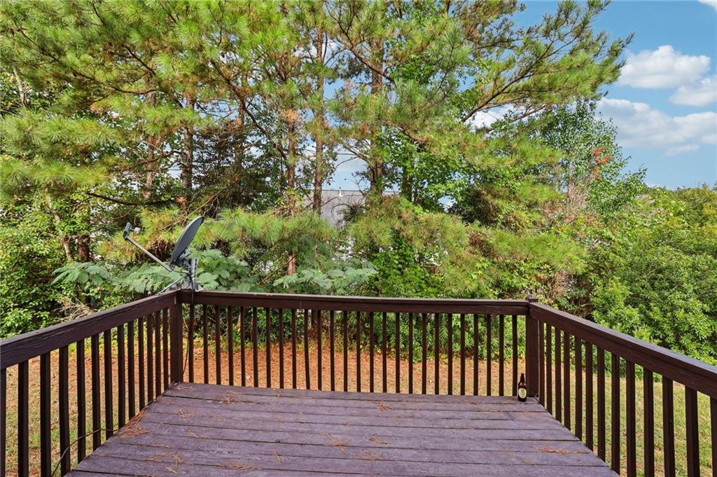 4031 Robin Circle Atlanta, GA 30349 - Photo 19 of 23 a balcony with wooden floor and fence