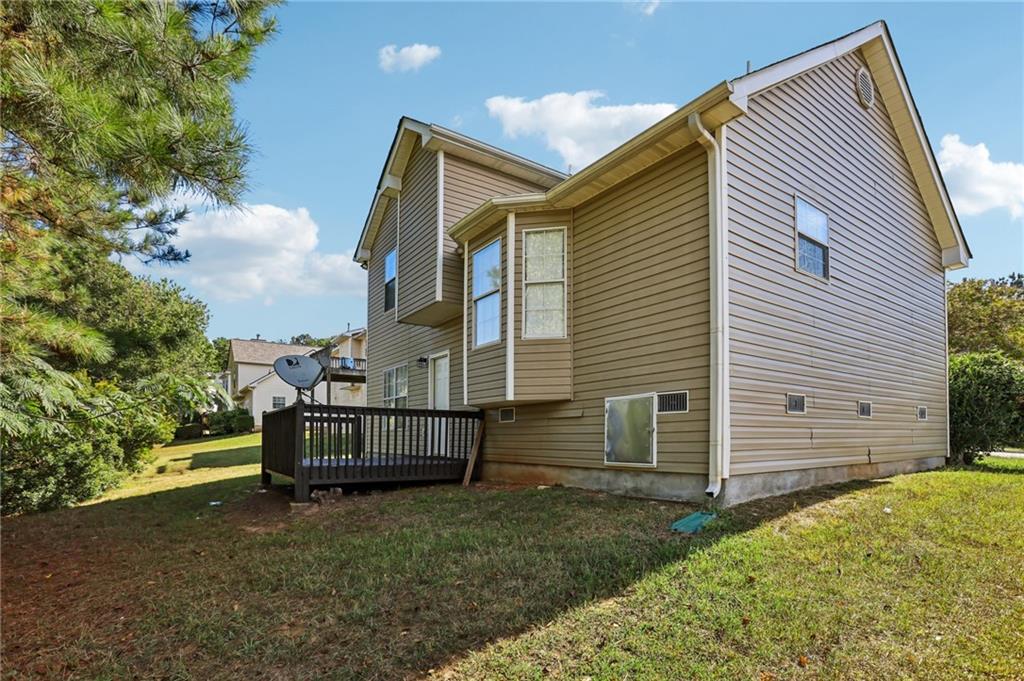 4031 Robin Circle Atlanta, GA 30349 - Photo 21 of 23 a view of house with a yard