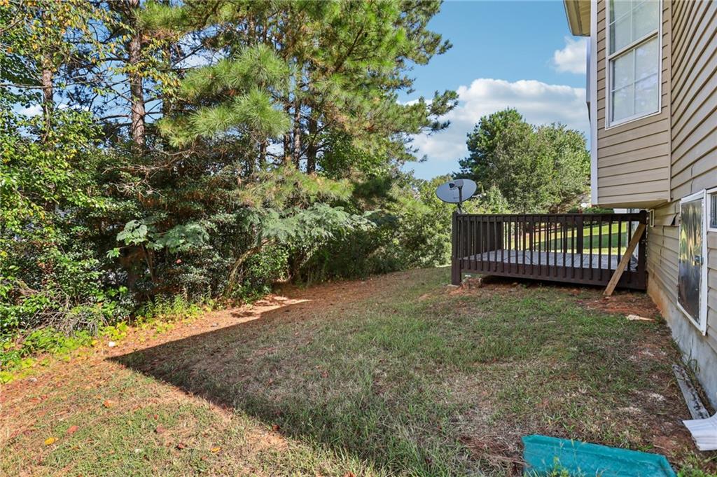 4031 Robin Circle Atlanta, GA 30349 - Photo 22 of 23 a view of a yard with wooden fence
