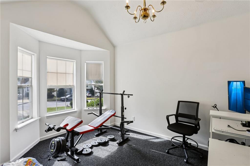 4031 Robin Circle Atlanta, GA 30349 - Photo 3 of 23 a view of a workspace with furniture and a window