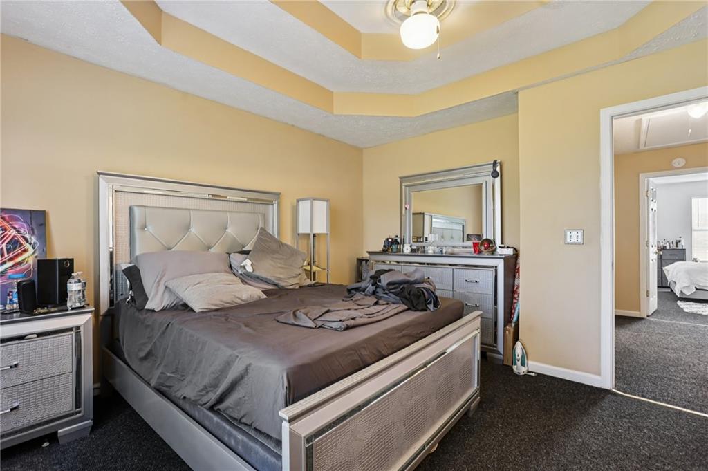 4031 Robin Circle Atlanta, GA 30349 - Photo 10 of 23 a bedroom with a bed and a dresser