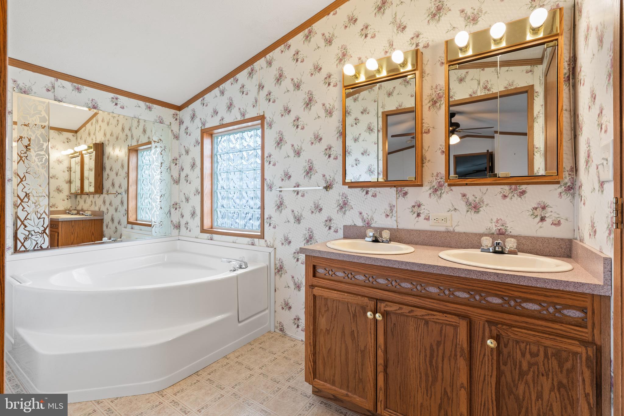 523 Canter Road Wilmington, DE 19810 - Photo 14 of 20 a spacious bathroom with a sink double vanity and a bathtub
