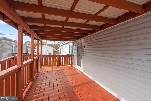a view of balcony with wooden floor
