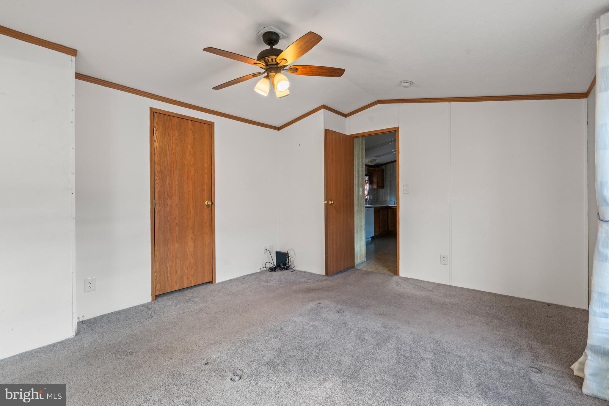 523 Canter Road Wilmington, DE 19810 - Photo 10 of 20 a view of an empty room with a ceiling fan