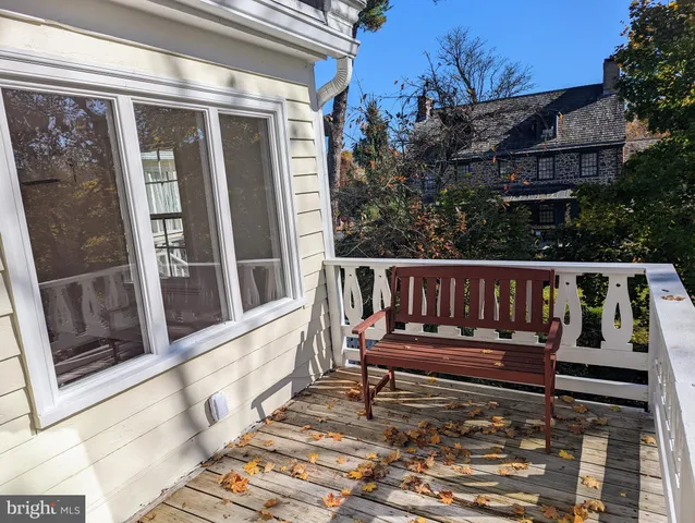 a view of balcony with wooden fence