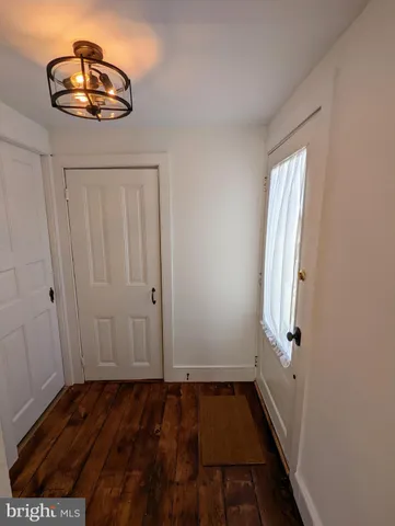 a view of fireplace and window