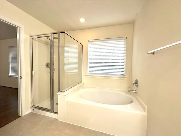 a bathroom with a sink a mirror and a shower