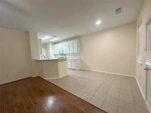 an empty room with wooden floor