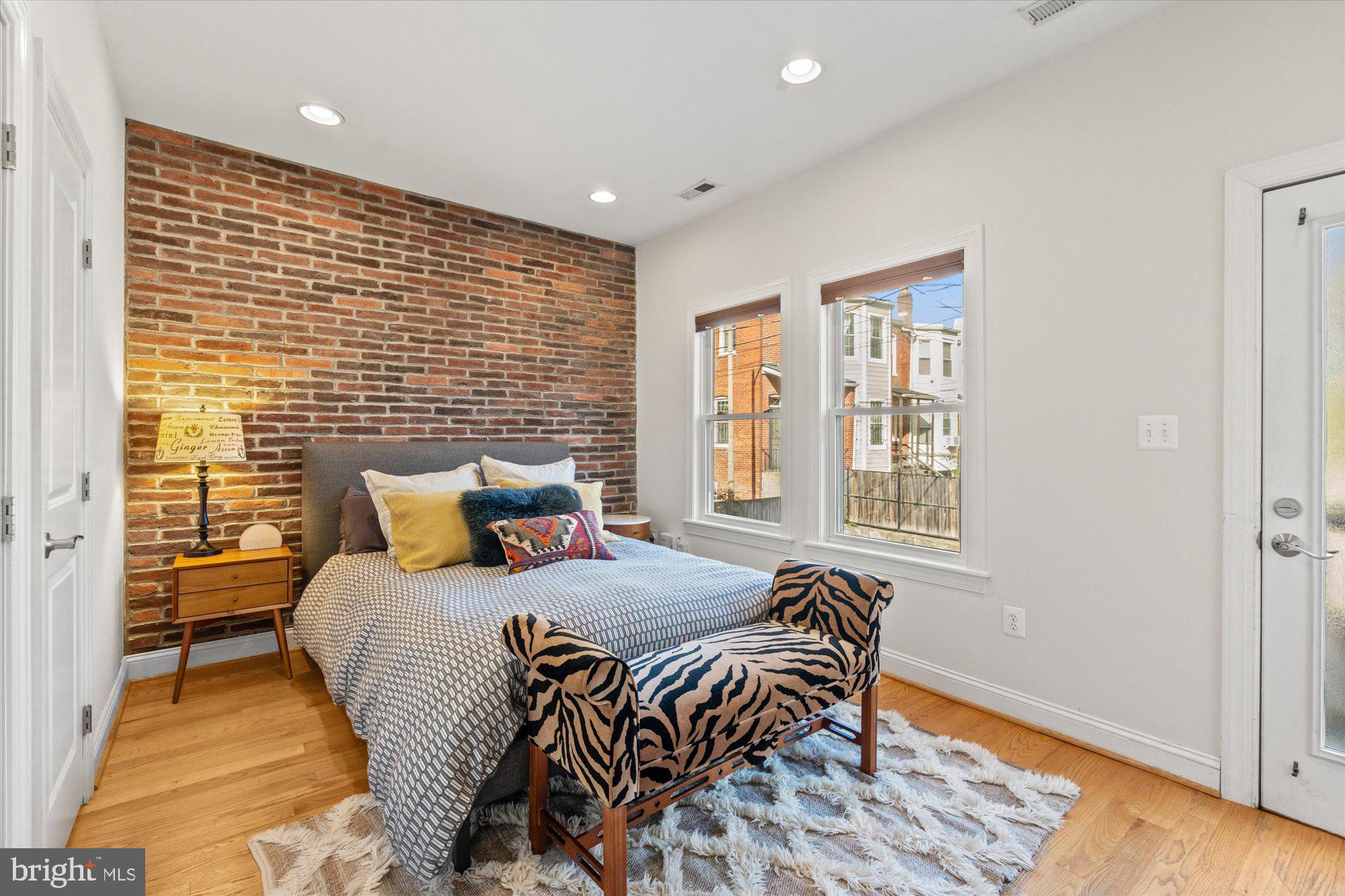907 Webster Street Northwest, Unit 2 Washington, DC 20011 - Photo 10 of 22 Primary bedroom with exposed brick