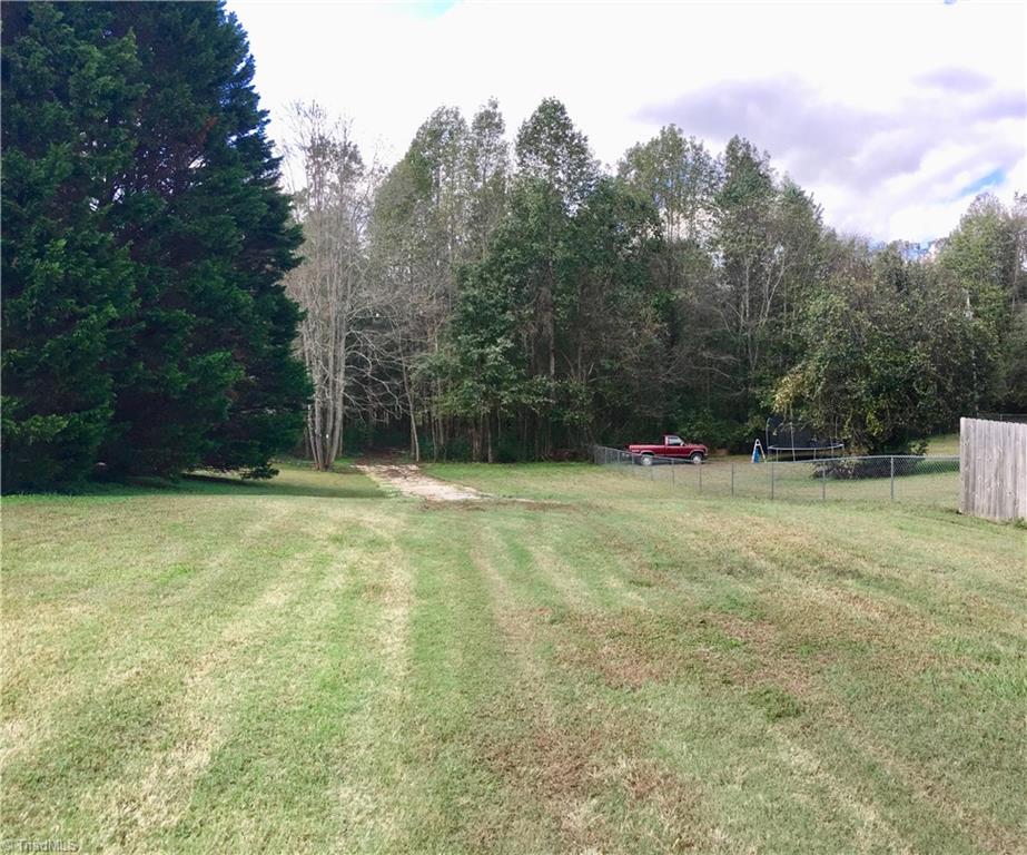13-acres Madison Road Mocksville, NC 27028 - Photo 6 of 25 Coming in from Madison Road. Looking at the entrance into the woods leading to the lake and potential homesites.