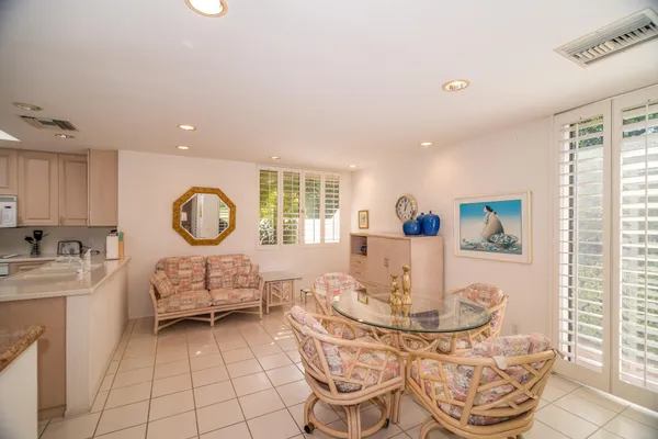 a living room with furniture a window and a table