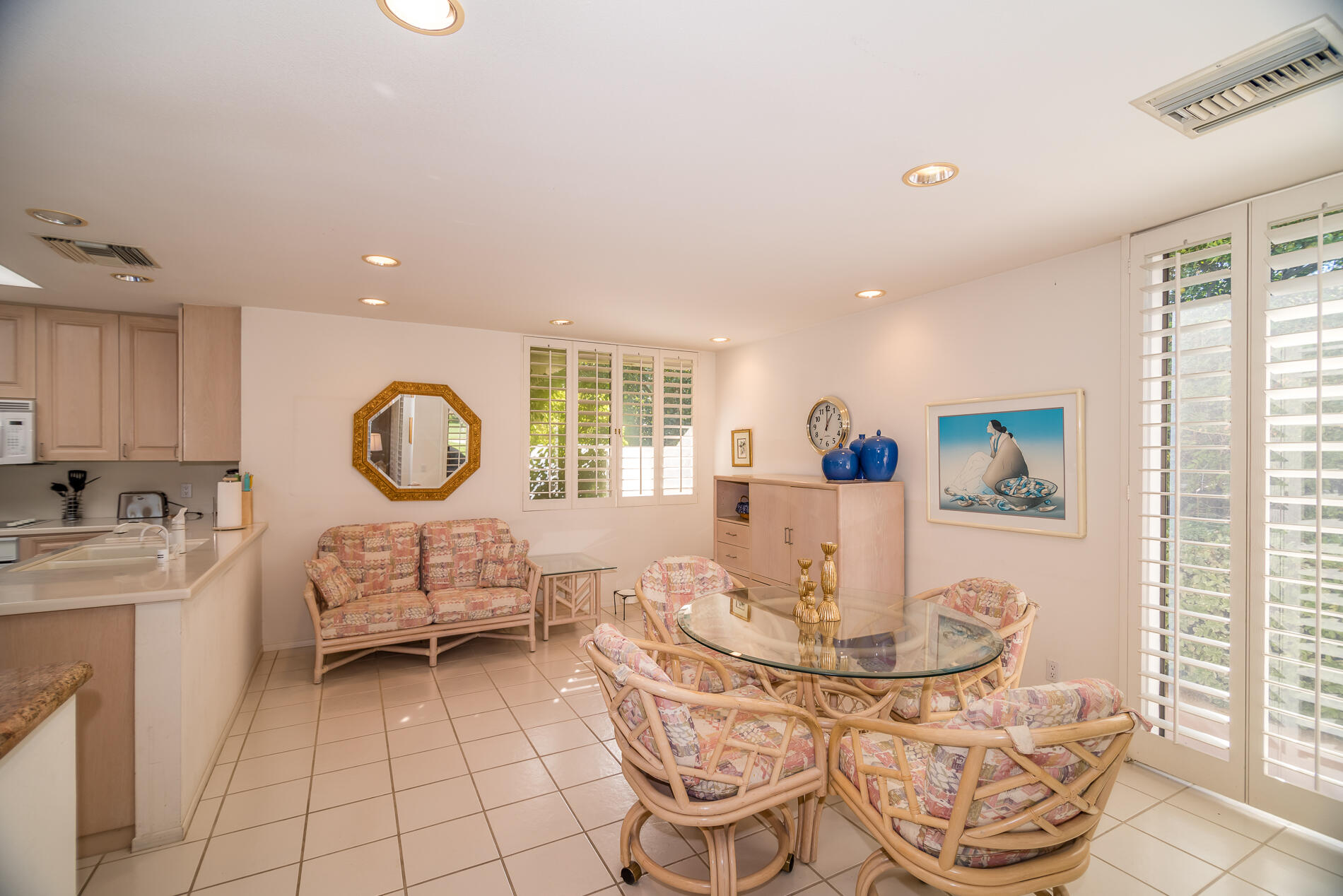 12 Columbia Drive Rancho Mirage, CA 92270 - Photo 11 of 25 a living room with furniture a window and a table
