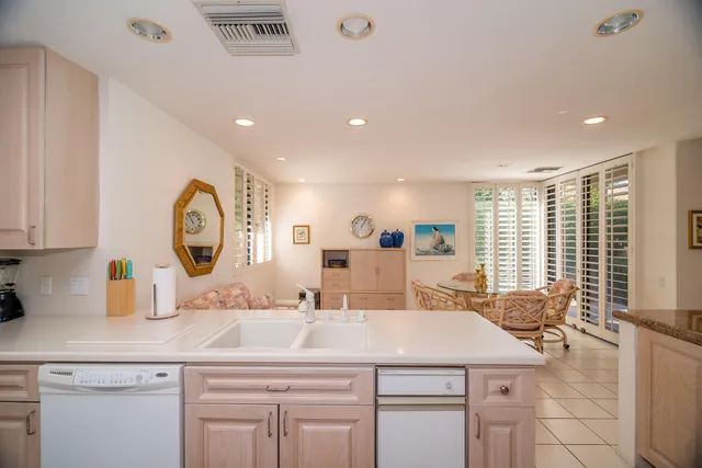 a kitchen with a sink and a refrigerator