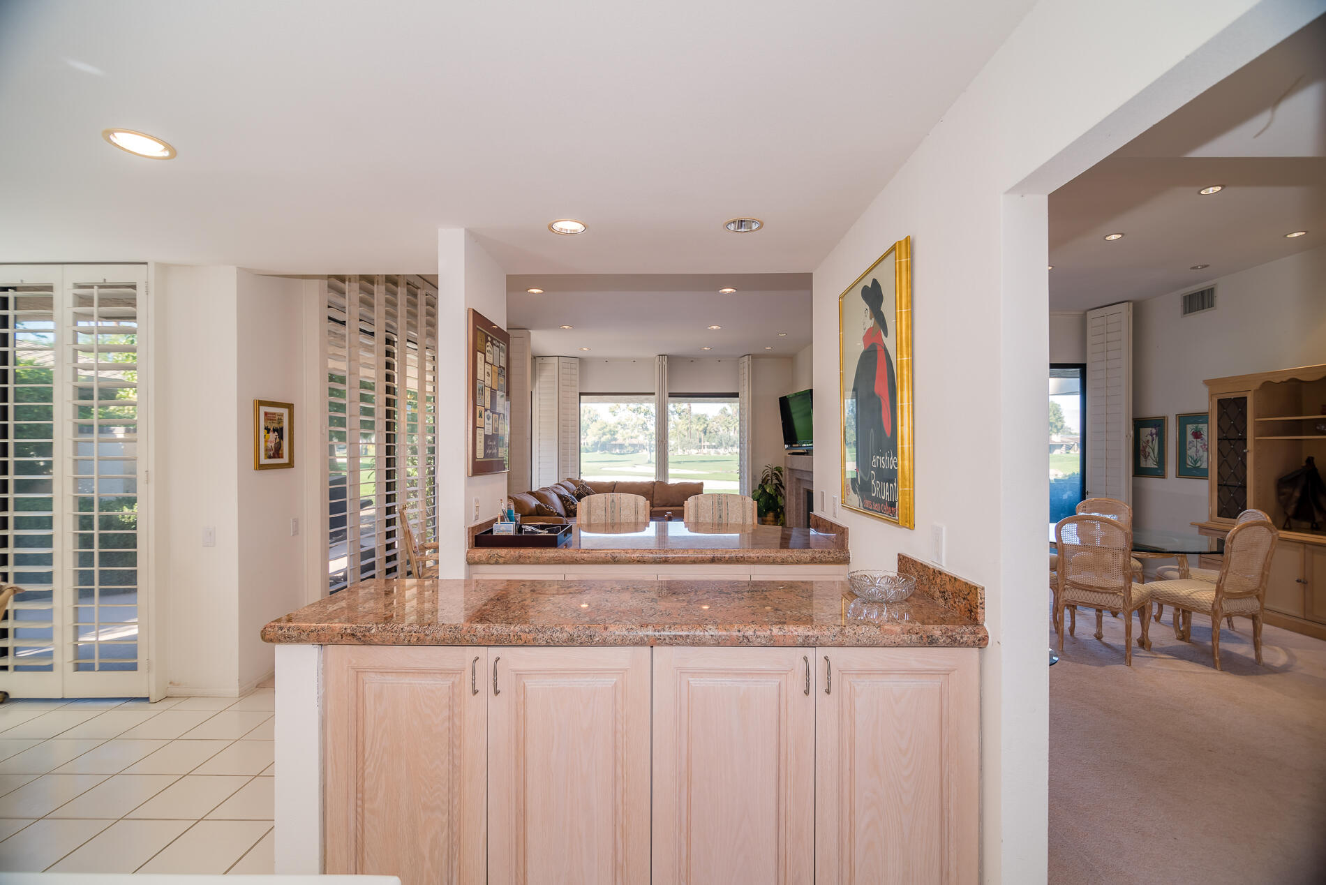 12 Columbia Drive Rancho Mirage, CA 92270 - Photo 15 of 25 a view of kitchen with granite countertop cabinets and living room