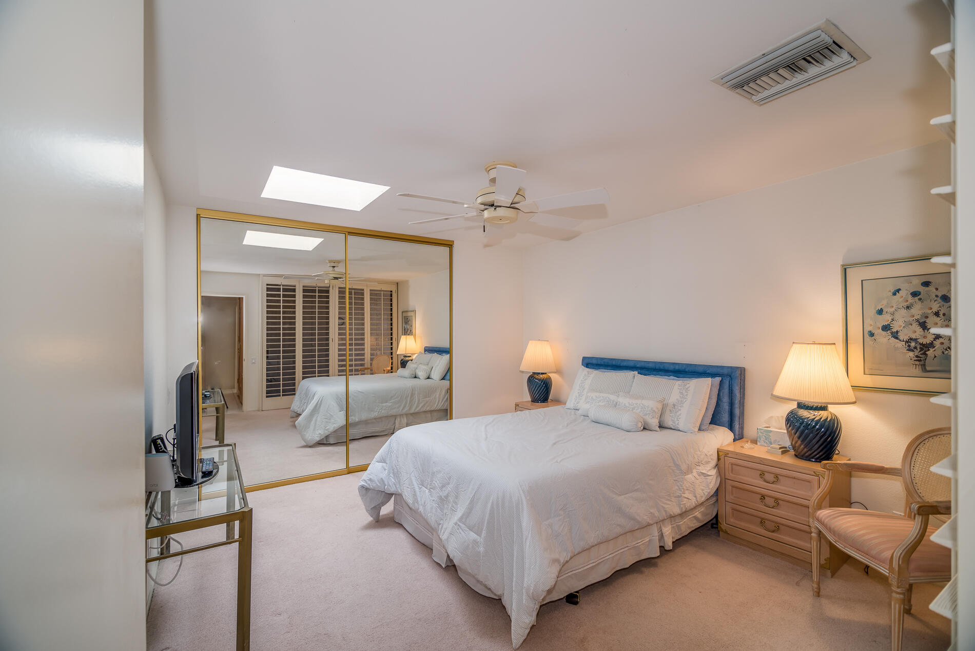 12 Columbia Drive Rancho Mirage, CA 92270 - Photo 19 of 25 a bedroom with a bed and a couch