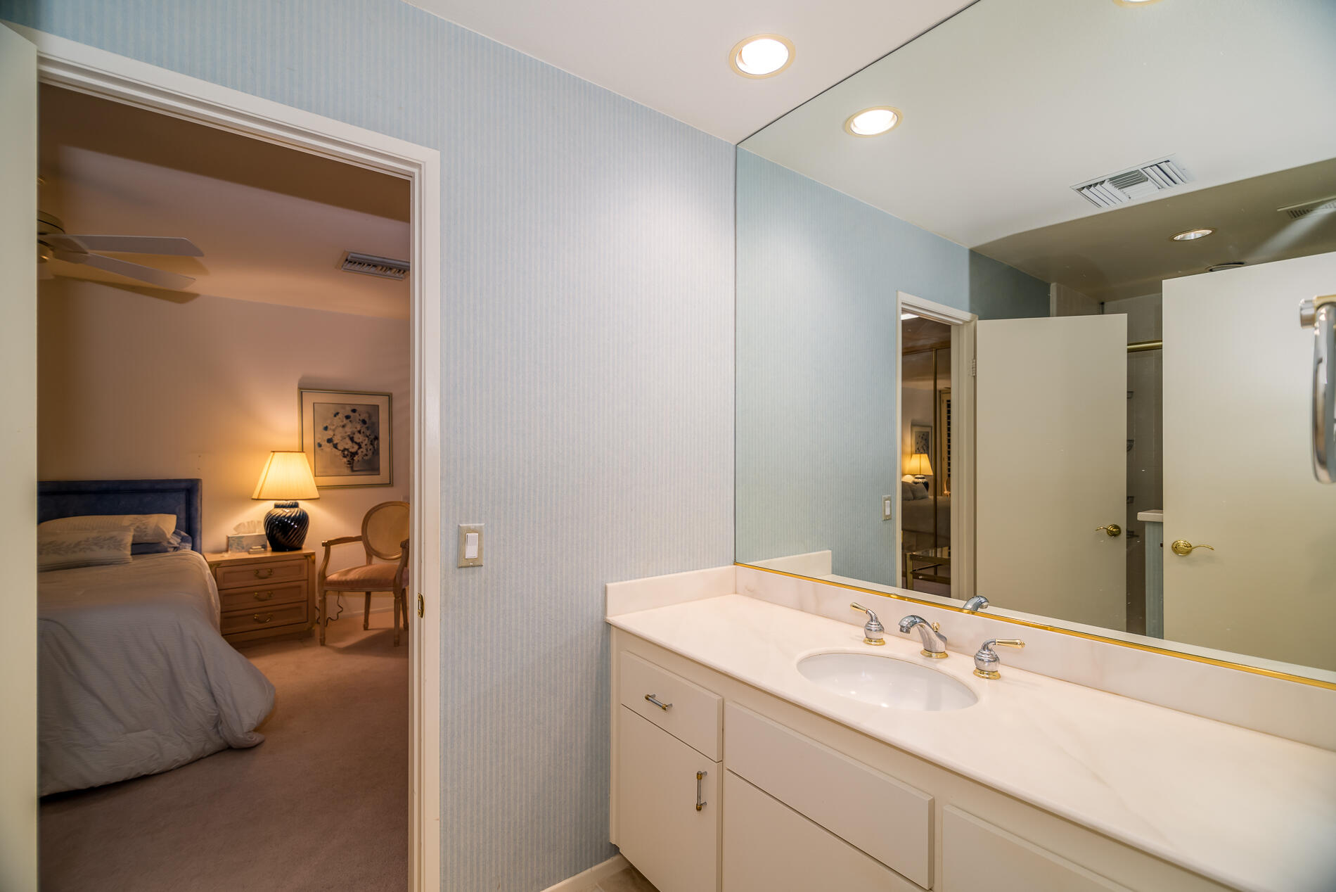 12 Columbia Drive Rancho Mirage, CA 92270 - Photo 20 of 25 a en suite bathroom with a double vanity sink and mirror