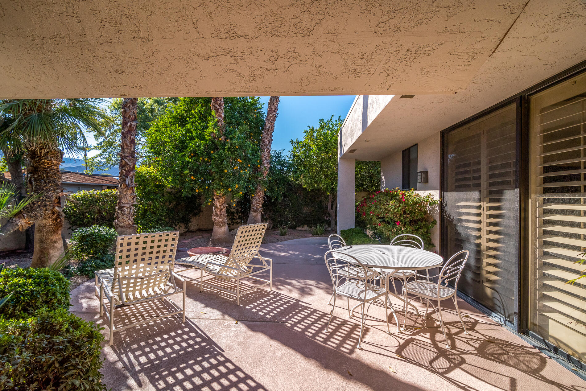 12 Columbia Drive Rancho Mirage, CA 92270 - Photo 2 of 25 a view of a patio with a couple of chairs