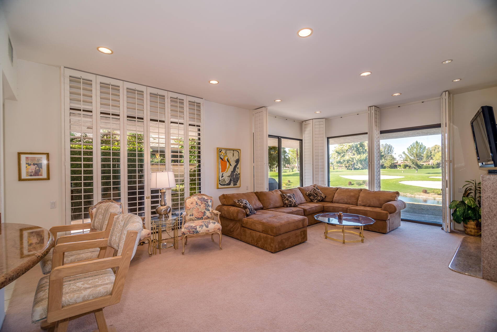 12 Columbia Drive Rancho Mirage, CA 92270 - Photo 7 of 25 a living room with furniture and a large window