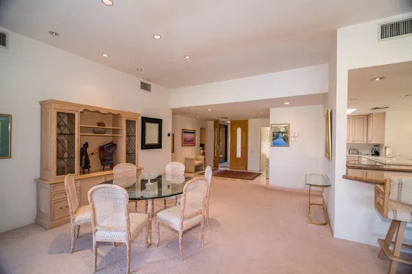 a dining room with furniture and window